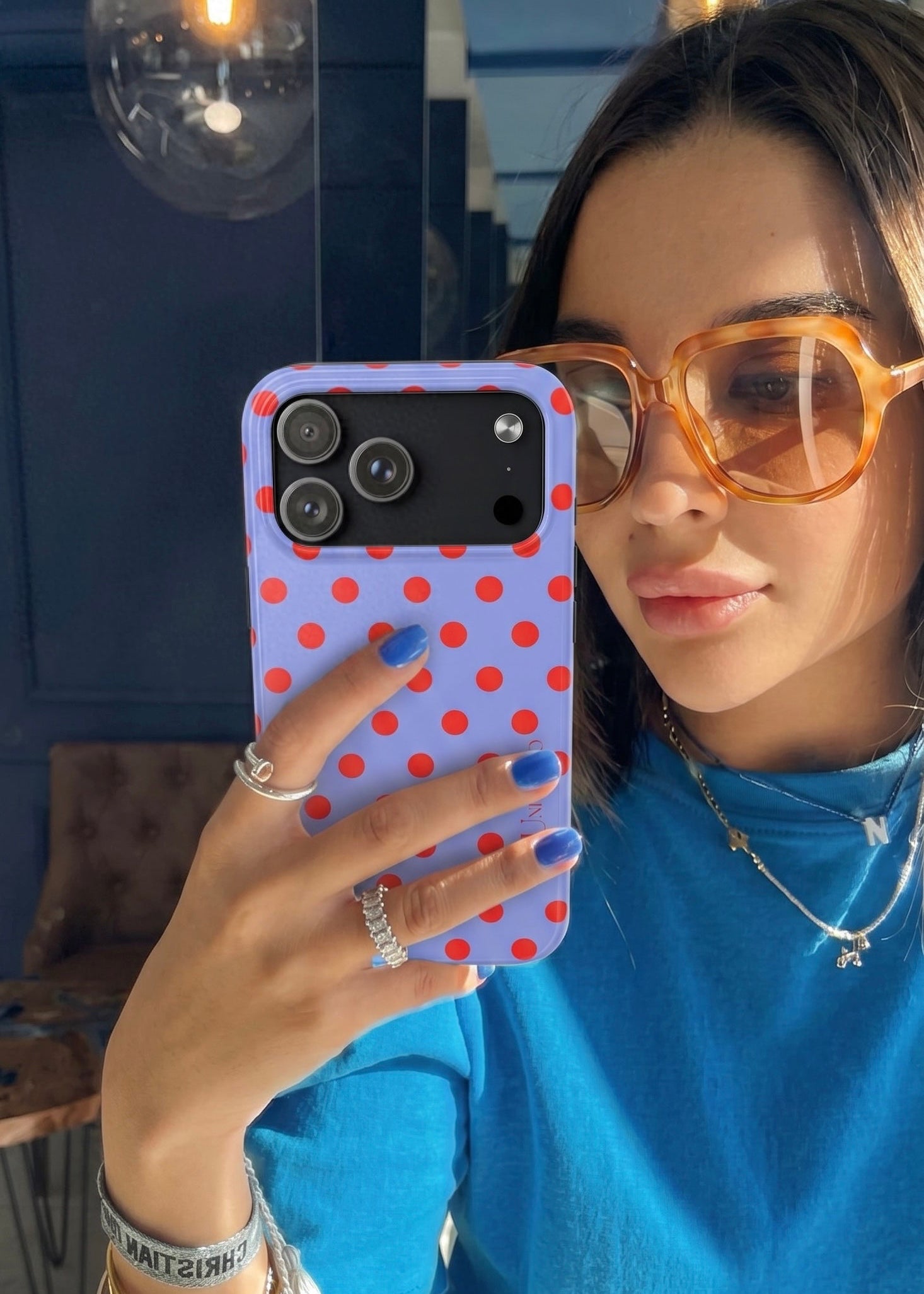 Muni Studio RED POLKA Tough Phone Case – lifestyle shot